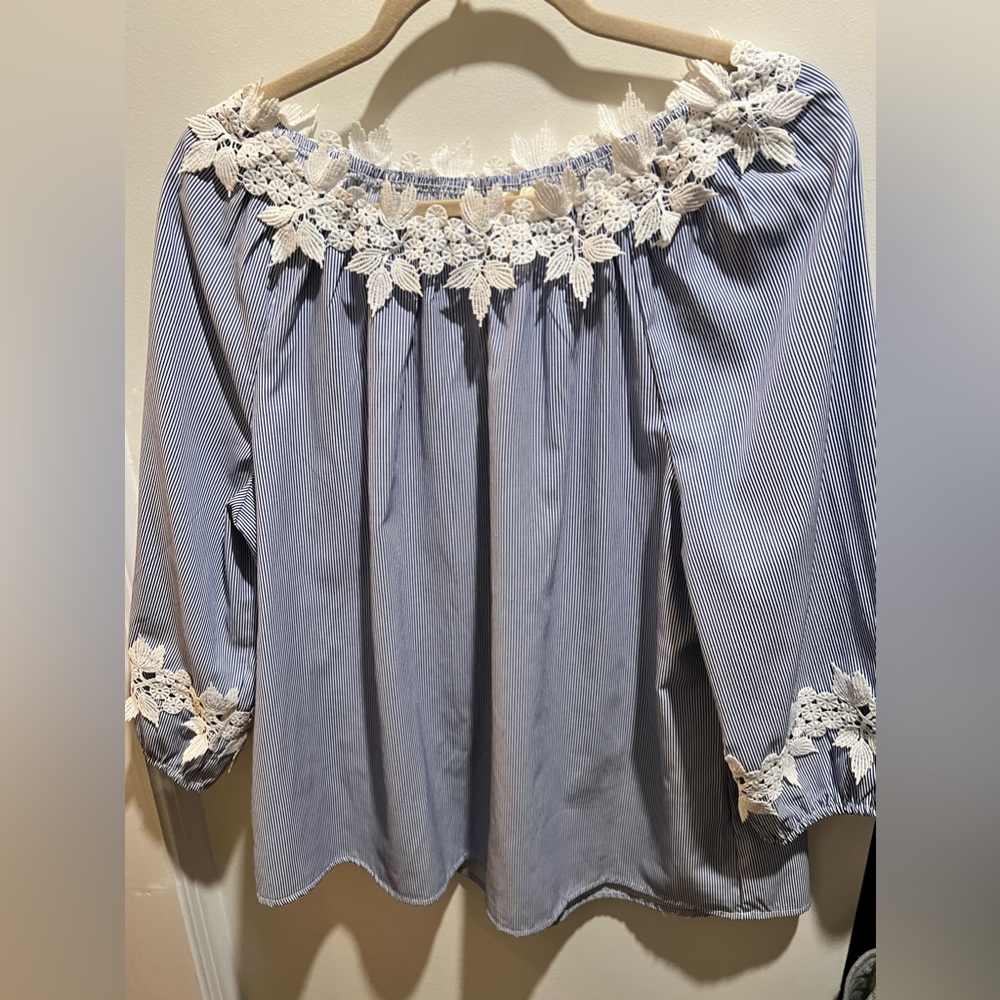 Very beautiful dressy blouse. So pretty for any occasion.